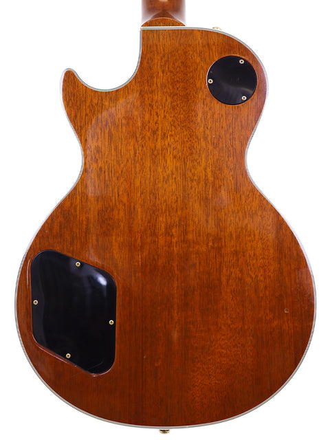 The back of a 1994 Gibson Les Paul Custom guitar, showcasing its elegant wooden body and classic craftsmanship.