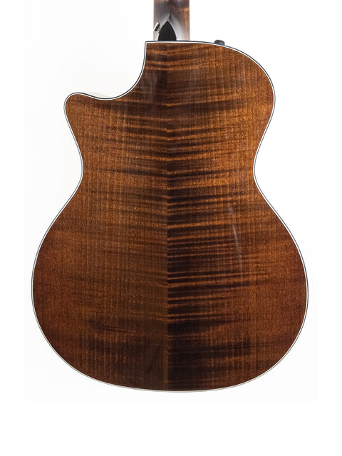 The back of a 2016 Taylor 614ce acoustic guitar, highlighting its beautiful design and quality materials.