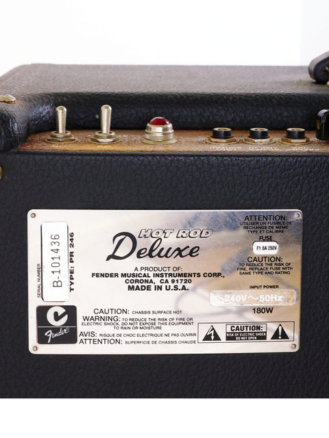 The back of a Fender Hot Rod Deluxe Combo Amp, labeled 'Deluxe', showcasing its USA 2000 craftsmanship and connections.

