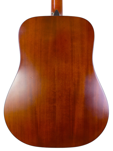The back of a K. Yairi W1S acoustic guitar, made in Japan in 1983, highlighting its beautiful craftsmanship and design.
