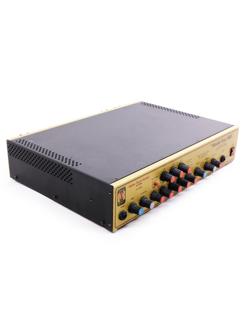 The gold and black amplifier, part of the Eden World Tour 800 Head and Epifani 600w Bass Cabinet, sits elegantly on a white surface.