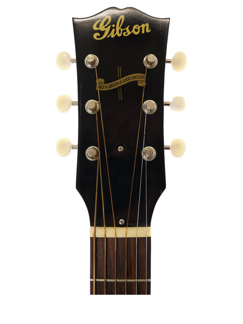 The headstock of a Gibson J-45 True Vintage guitar, emphasizing its iconic design and quality from the USA, 2012 model.