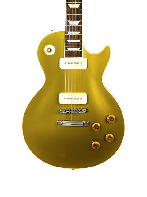 The iconic Gibson Les Paul Custom Goldtop, a 2019 limited edition reissue, featuring a classic design and rich golden finish.