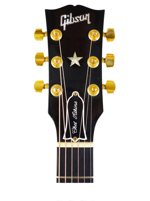 The iconic black Gibson Les Paul Custom Shop guitar, highlighting its premium features and vintage appeal from 1998.