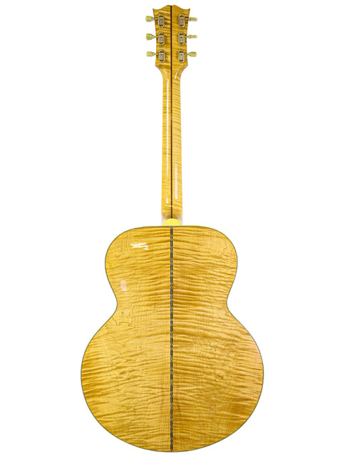 The image displays a 2001 Gibson SJ-200 guitar, highlighting its elegant wooden back and neck design.