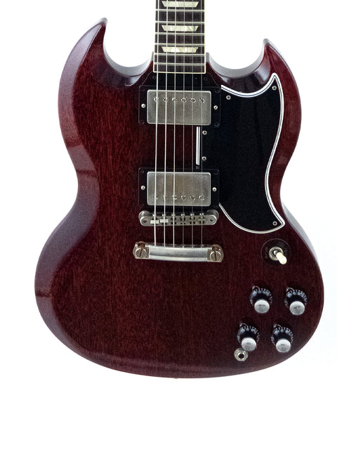 The image features a red Gibson Custom ’61 Les Paul SG Standard electric guitar, complete with a bold black pickup.