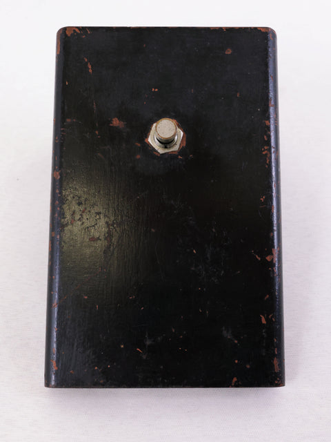 The image shows a black box topped with a metal nut, showcasing the Baldwin Burns Buzzaround Fuzz Pedal, UK 1966.

