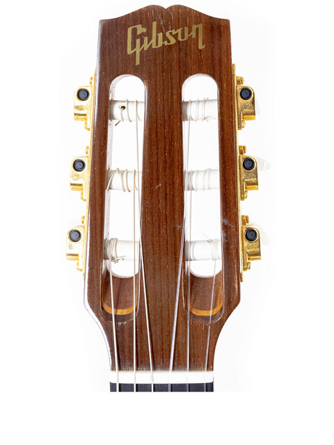 The neck of a 2001 Gibson Chet Atkins CEC guitar displayed on a white background, highlighting its smooth finish and frets.