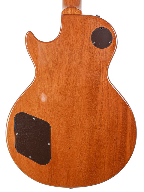 The rear side of a Gibson Les Paul LPR-4 1954 Reissue guitar, highlighting its rich wooden texture and craftsmanship.