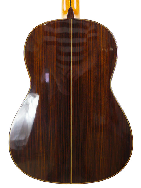 The wooden back of a Francisco Esteve 9C/B acoustic guitar, highlighting its craftsmanship from Spain, made in 2021.