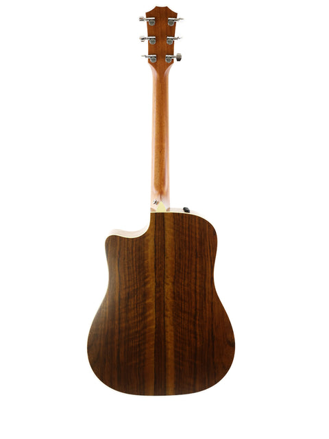 The wooden back of a Taylor 410CE acoustic guitar, highlighting its craftsmanship, made in the USA in 2011.

