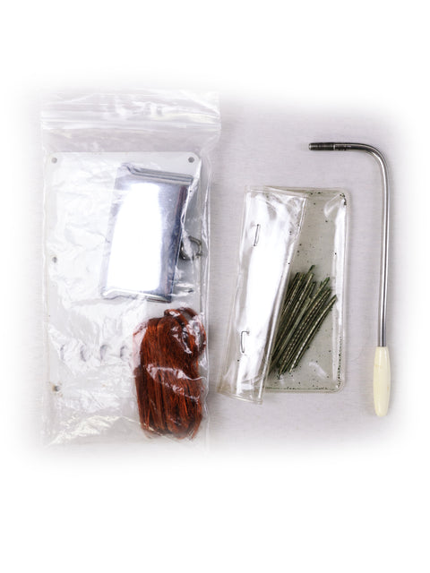 Tools including a screwdriver in a plastic bag, alongside a vintage 1964 Fiesta Red Fender L Series Stratocaster.