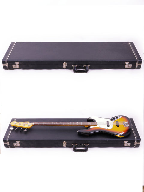 Two bass guitars, including a Fender Custom Shop '64 Jazz Bass Relic, displayed in a case against a white background.
