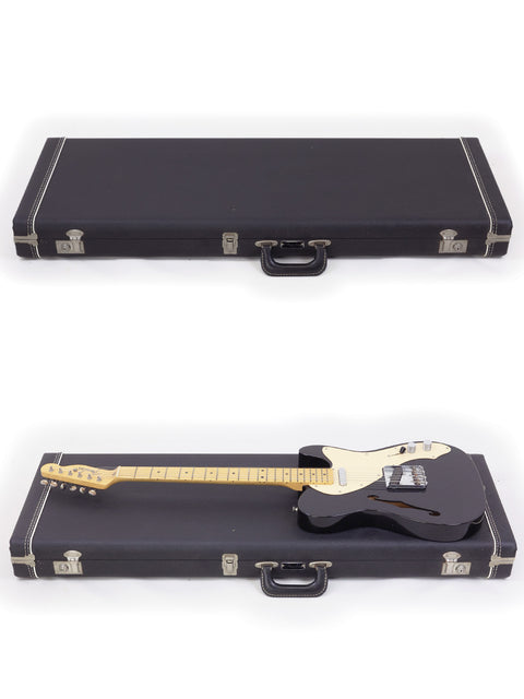 Two black guitar cases with a Fender Custom Shop Telecaster Thinline inside each, showcasing their sleek design.