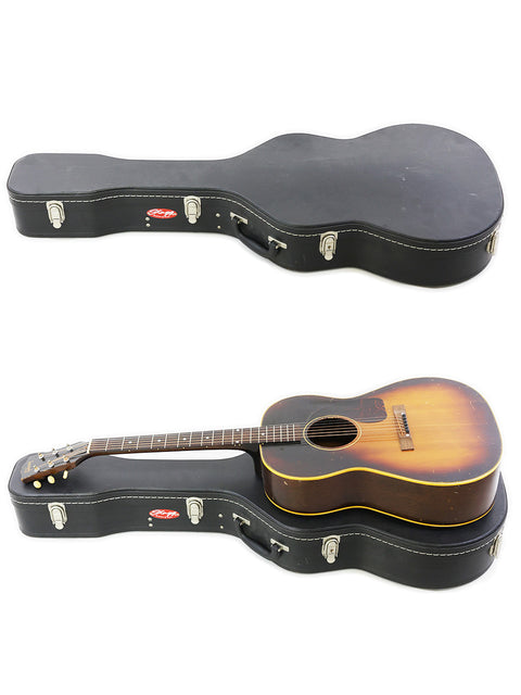 Two guitars, one a vintage 1954 Gibson LG-2, in cases on a stark white background.
