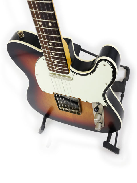 Txxx Custom Style Partscaster from 2021, featuring a black body and a beautiful sunburst neck design.