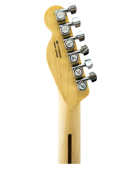 Txxx Custom Style Partscaster in Pelham Blue, featuring a wooden body and metal bridge, captured from the guitar head.