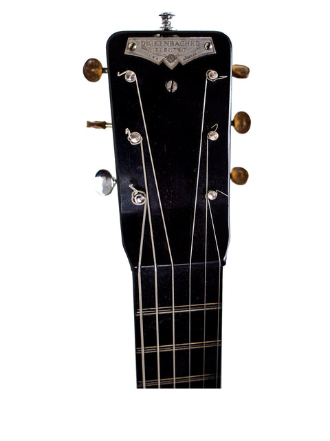 Vintage 1930s Gibson D-18E acoustic guitar with a Rickenbacher Electro Lap Steel, highlighting classic American guitar design.
