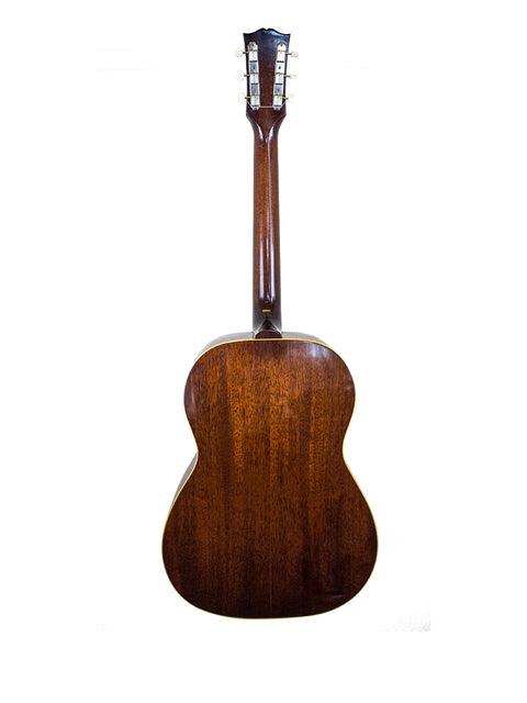 Vintage 1951 Gibson J-45 acoustic guitar, showcasing its classic design and rich wood finish.
