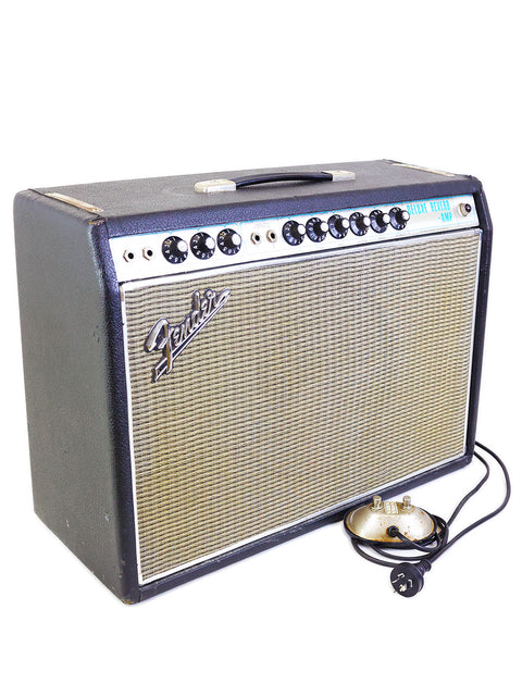 Vintage 1967 Fender Deluxe Reverb amplifier with a cord, exemplifying iconic sound and retro aesthetics.