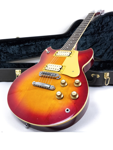 Vintage 1981 Yamaha SG 800S guitar in a sunburst finish, snugly placed in its case, ready for a jam session.
