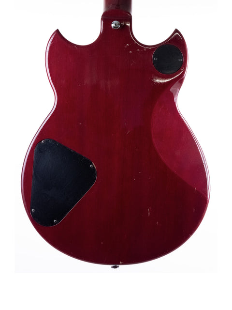 Vintage 1981 Yamaha SG 800S guitar in red with a stylish black pickguard, ready to rock any stage.