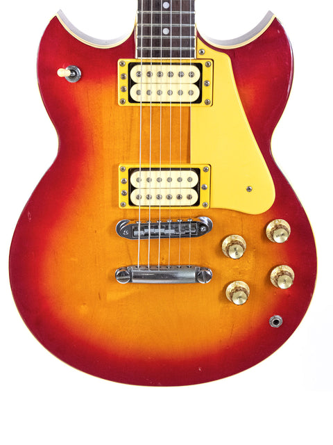 Vintage 1981 Yamaha SG 800S guitar with a bold red body and a sunny yellow neck, showcasing its unique design.
