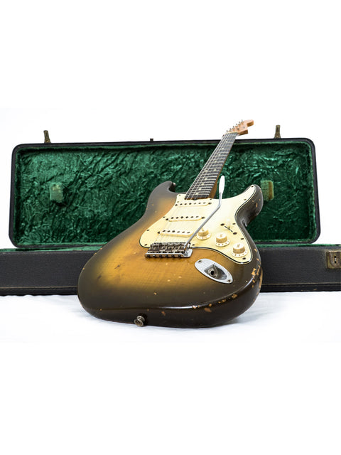 Vintage L Series 1963 Fender Stratocaster guitar nestled in a protective case, emphasizing its iconic design.
