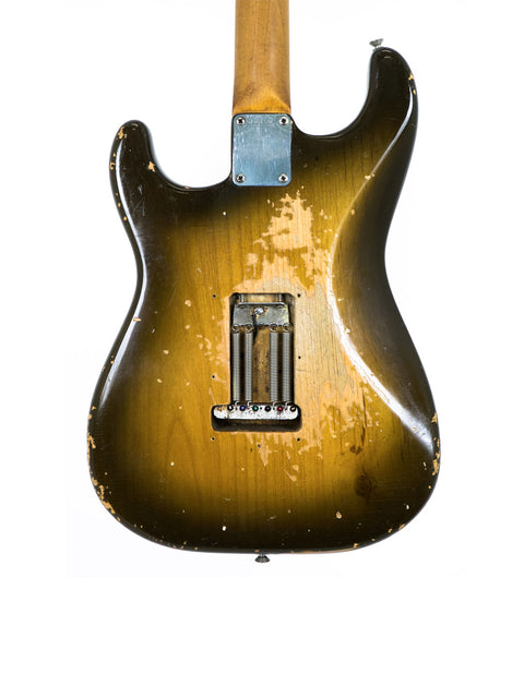  Vintage L Series 1963 Fender Stratocaster guitar with a distinctive brown and yellow finish, representing classic American design.