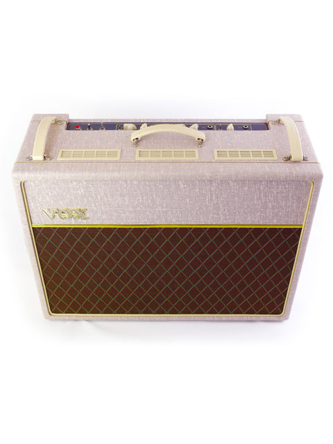Vintage Vox AC30HW2 amplifier in a sleek white and brown design, a must-have for any guitar enthusiast's collection.
