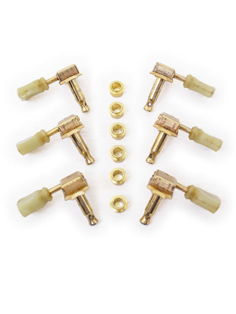  Vintage brass knobs and screws arranged together, showcasing original 1960 Kluson tulip button tuners for musical instruments.
