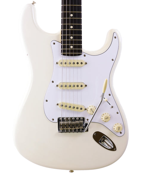 White electric guitar with dark fretboard and three pickups on a white background.