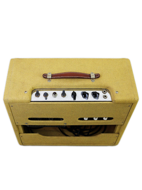Yellow Fender EC Tremolux Combo Amplifier (2014) with a stylish leather strap, perfect for musicians on the go.
