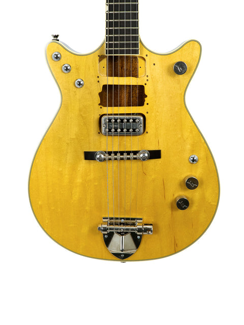Yellow Gretsch G6131 Malcolm Young Signature Jet guitar with a striking black pickguard, showcasing its unique design.
