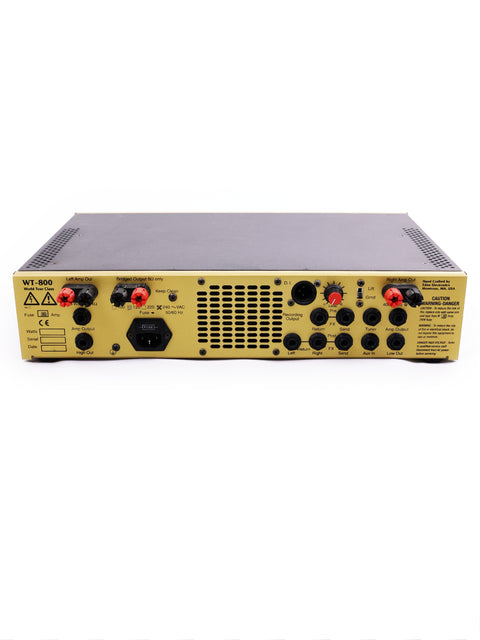Yellow amplifier's rear side showcasing red and black buttons, part of the Eden World Tour 800 Head and Epifani 600w Bass Cabinet.