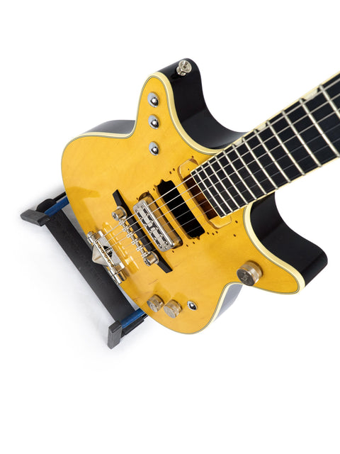 Yellow electric guitar, Gretsch G6131 Malcolm Young Signature Jet, with a stylish black pick guard, made in Japan 2020.