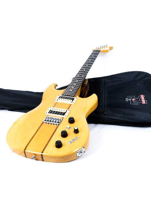 Yellow electric guitar nestled in a black case, representing the Aria Pro II TS 400 Tri Sound Series, made in Japan, 1980.