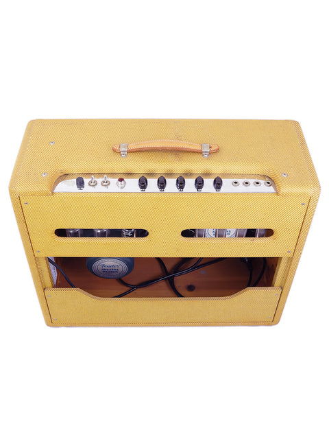 Yellow guitar amplifier with a black head, exemplifying the classic 1957 Fender Twin Reissue Amp, crafted in 2006, USA.