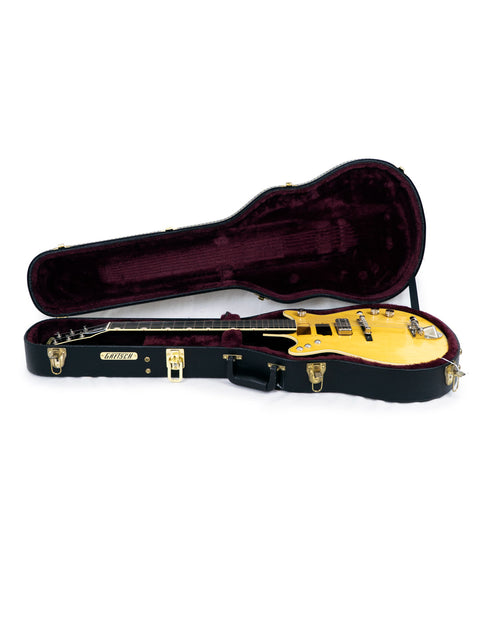 Yellow guitar case with a black design, showcasing the Gretsch G6131 Malcolm Young Signature Jet made in Japan, 2020.