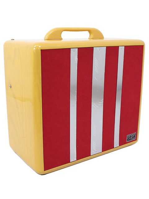 Yellow vintage portable guitar amplifier case with red and white vertical stripes.