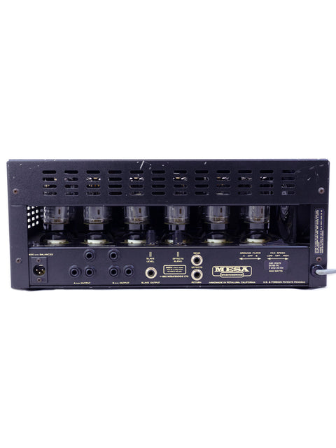 black Mesa Boogie Bass 400+ amplifier from 1993, featuring four speakers stacked on top for enhanced sound output.
