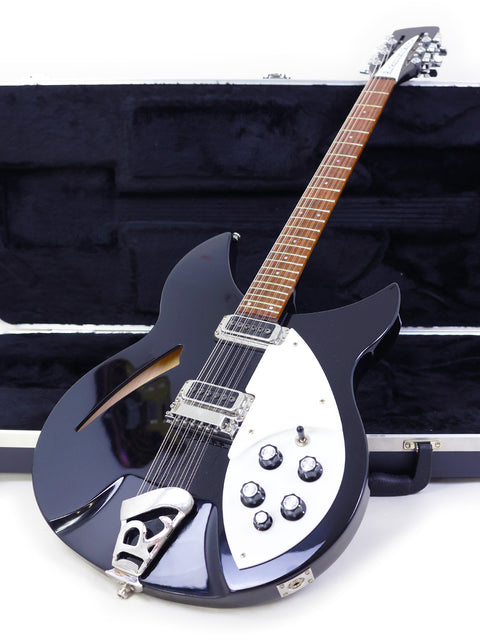 black Rickenbacker 330 12-string electric guitar with a case, highlighting its elegant design and USA craftsmanship from 2020.