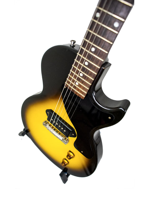 black and yellow Gibson Custom Shop '57 Les Paul Junior Reissue VOS guitar against a clean white background.