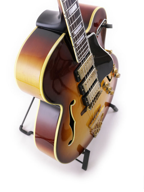 classic 1959 Gibson ES-5 Switchmaster guitar resting on a stand, highlighting its timeless craftsmanship and beauty.
