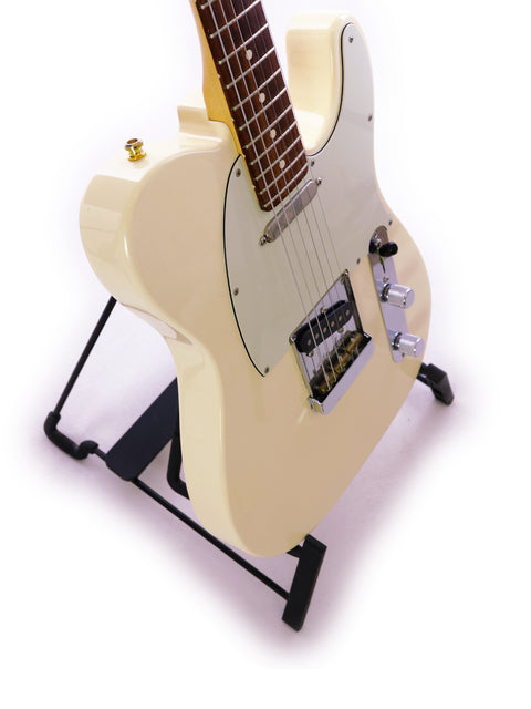 A cream-colored electric guitar on a black stand against a white background.
