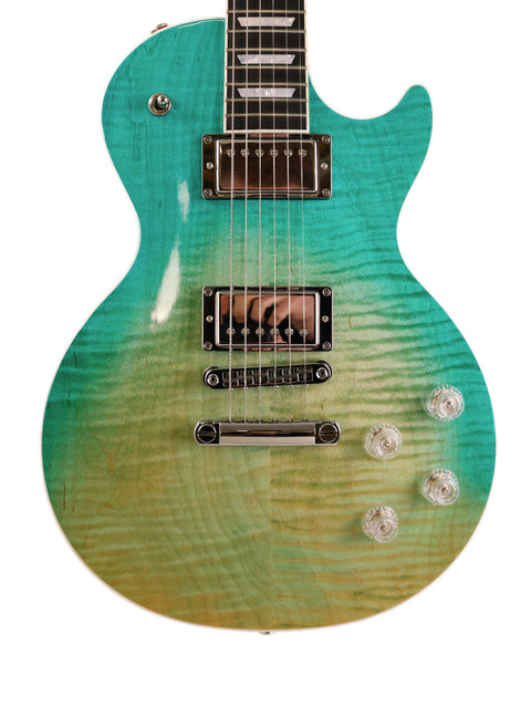 green and blue Gibson Les Paul HP guitar against a clean white background, showcasing its vibrant colors and sleek design.