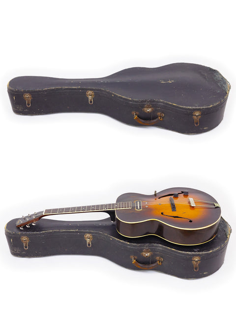 pair of guitars, including a 1938 Gibson ES-150, displayed in a case on a bright white backdrop.
