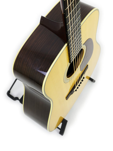 pristine white background highlights the Collings D2H guitar from 2006, emphasizing its classic shape and quality materials.