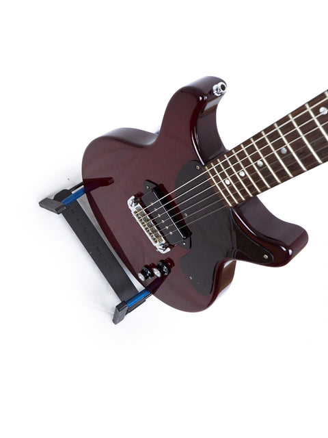 vibrant red electric guitar featuring a sleek black pick guard, representing the 1980s Burny "Rockin Roll Version" Les Paul Jr.