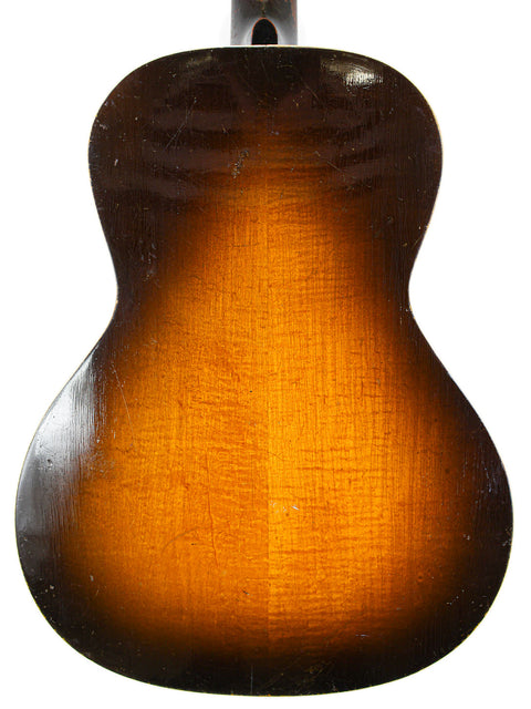 vintage 1930 Gibson J-45 sunburst guitar, showcasing its rich color and classic design, with a 'Century of Progress' label.